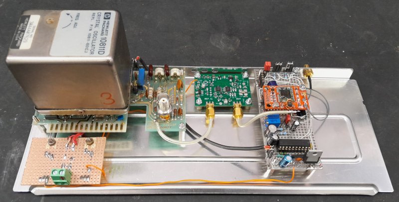 Photo of HP10811, PLL board and protoboard with ublox and microcontroller on a chassis