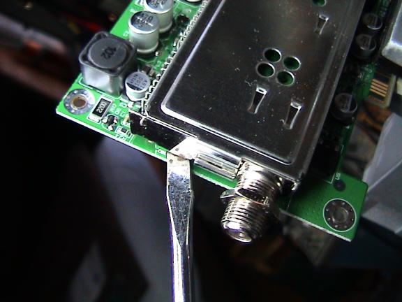 A screwdriver wedged under the tuner
